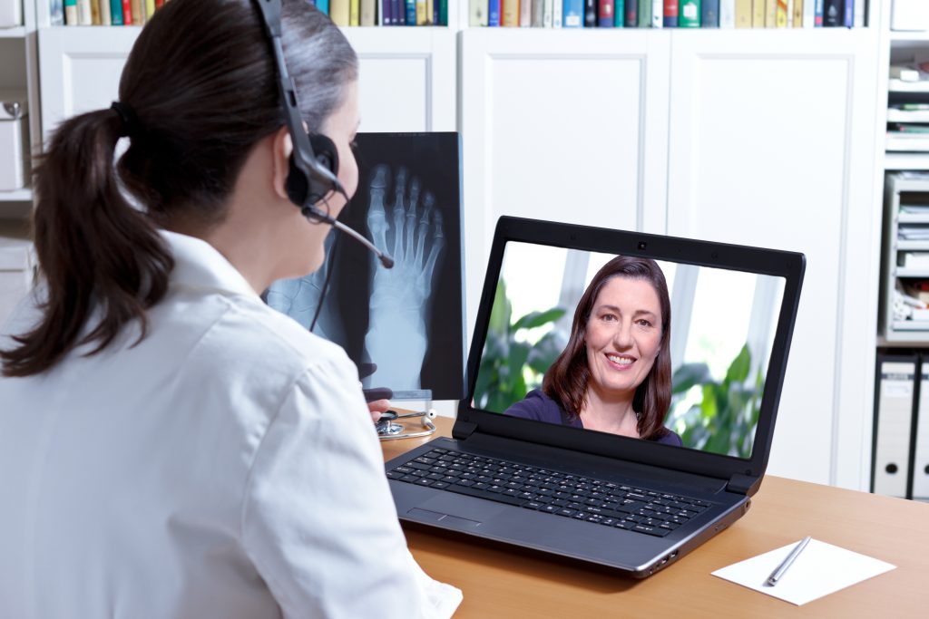 a businesswoman talking with client via VoiP