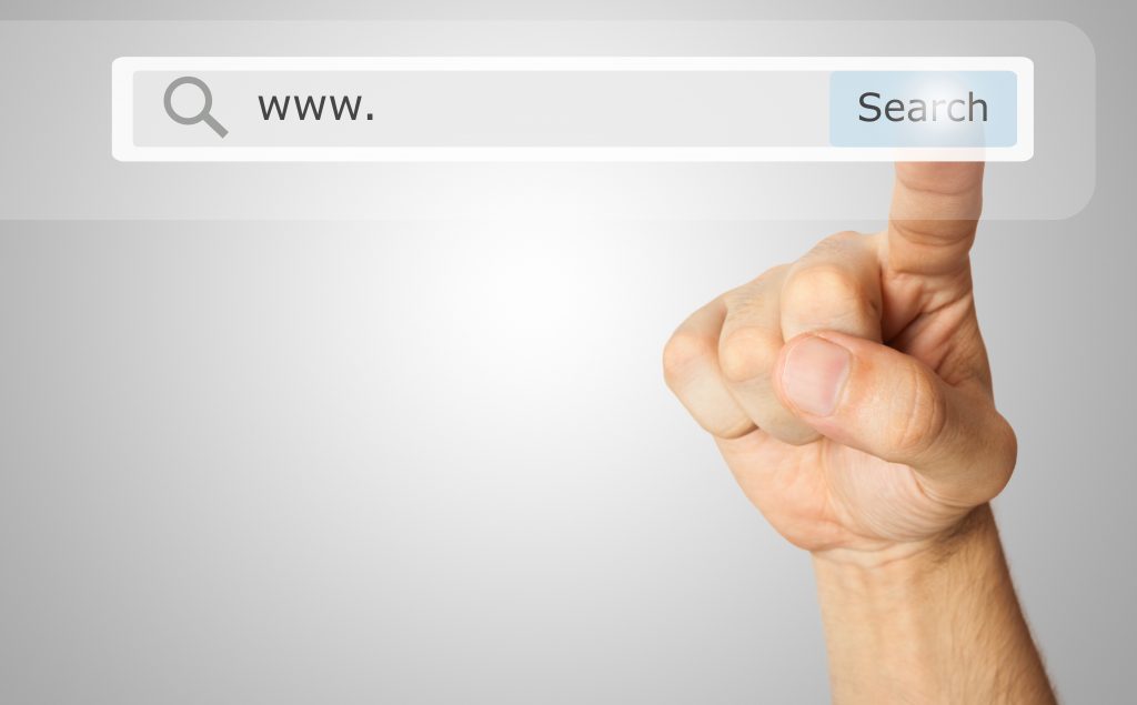 Hand touching search button